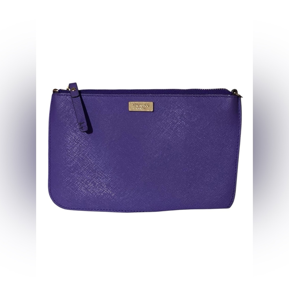 Kate Spade Newbury Lane Lolly wristlet in purple saffiano leather. 8”x 5”   Read